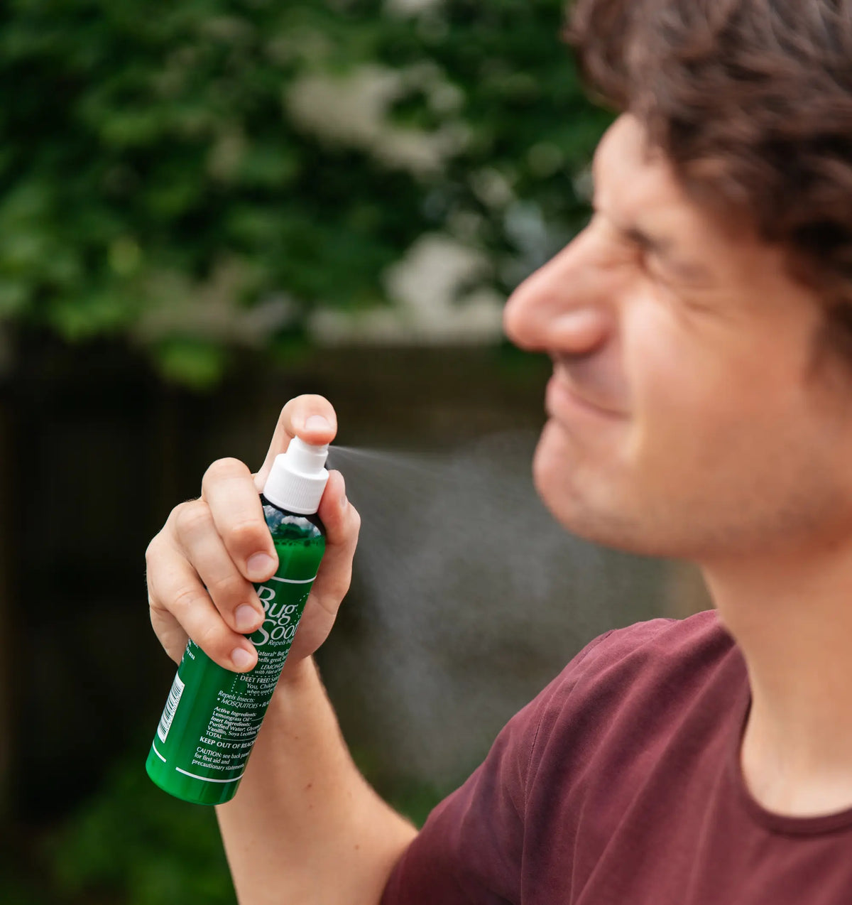 Advertisement of a man spraying Bug Soother. 