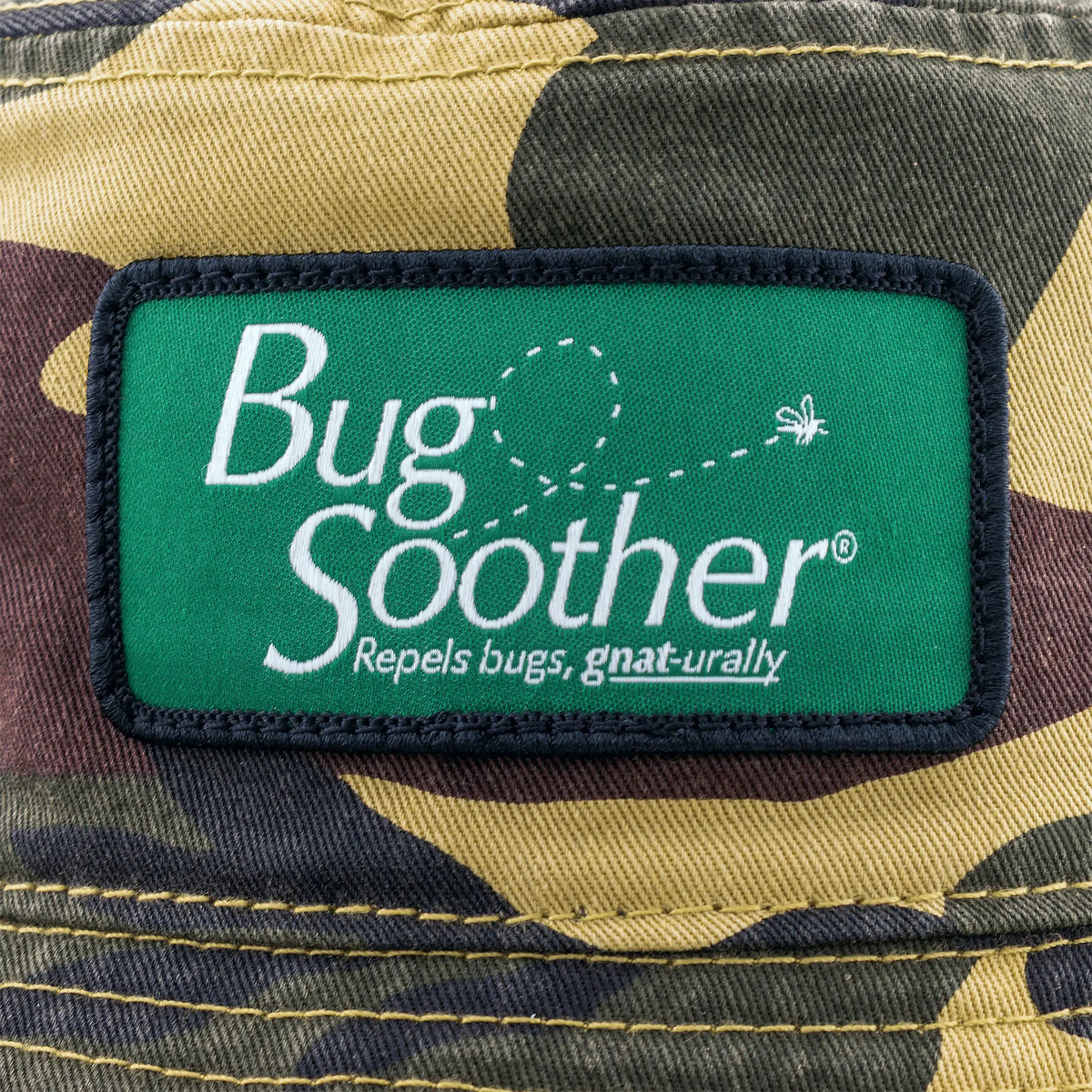 A close up of the Bug Soother logo on the Camo hat. 